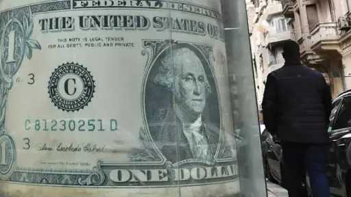 US Dollar Holds Steady Against...